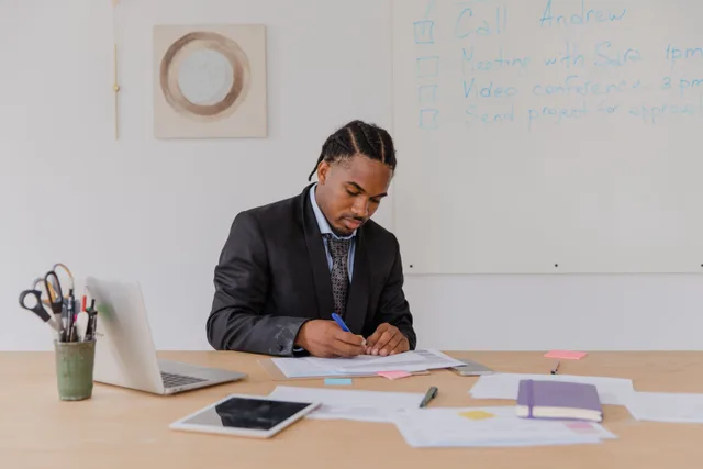 Professional man reviewing documents at his office desk with attention to detail. Can you trust an operations case study without questioning the author?