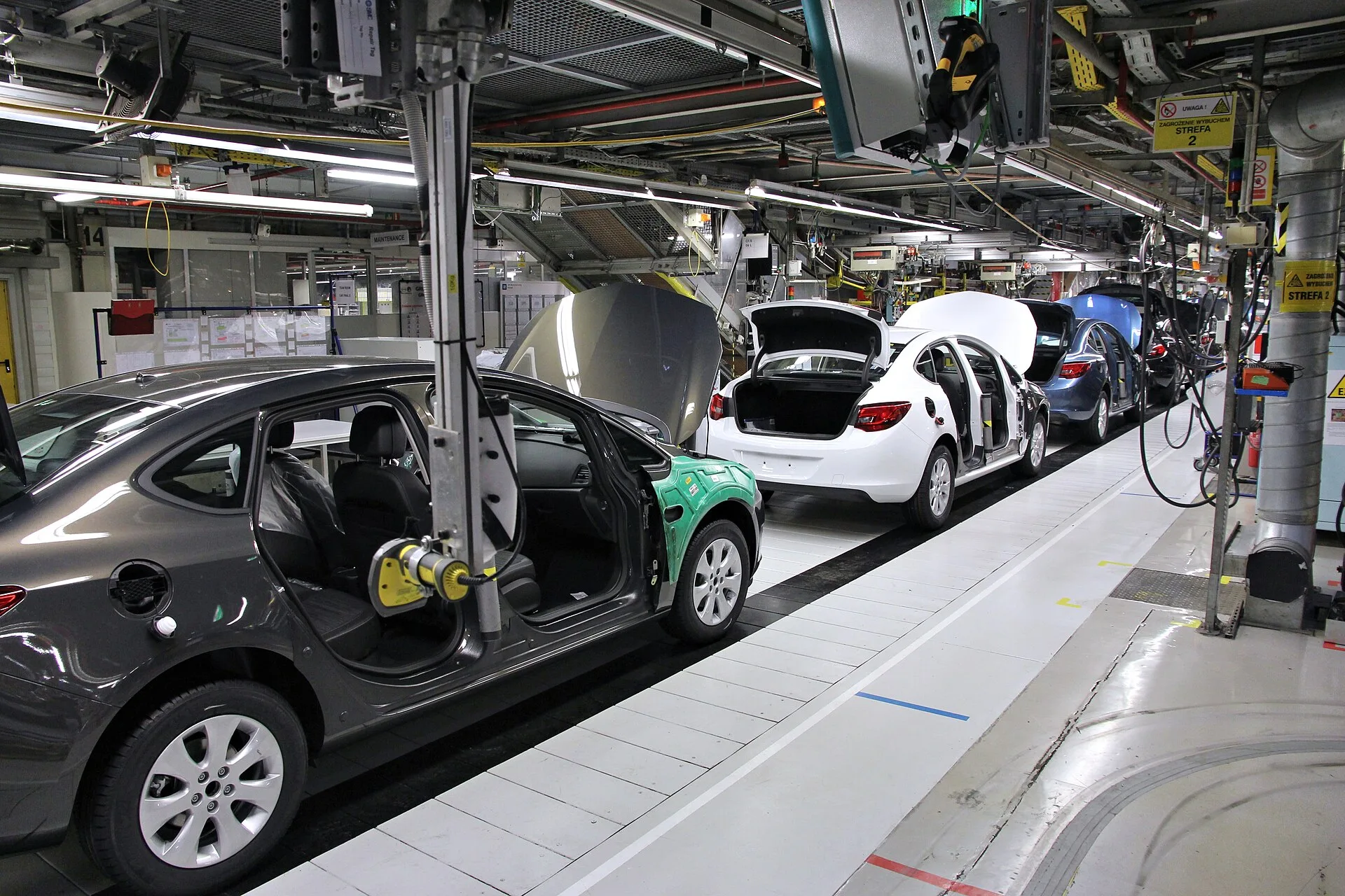 Car factory assembly line. Opel Astra J manufactured in General Motors Manufacturing Poland plant in Gliwice. Where the productivity systems examples agree, and where they do not