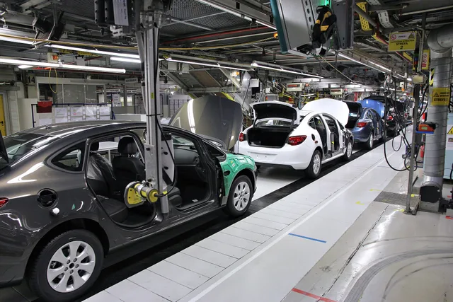 Car factory assembly line. Opel Astra J manufactured in General Motors Manufacturing Poland plant in Gliwice. Where the productivity systems examples agree, and where they do not