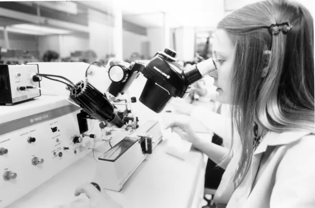 A quality control inspector reviews product using a microscope. Intel Free Press story: A Look Back on the Early Years -- Intel photo archives: Silicon Valley technology legends from the 1970s. Quality management: practical process guidance